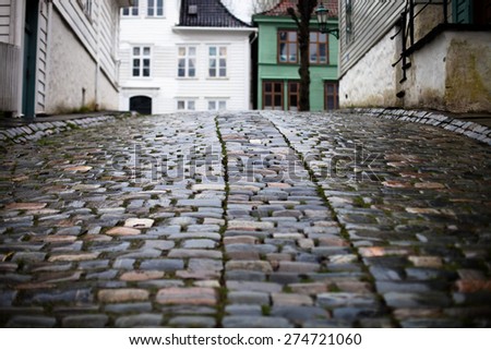 Closeup of wet cobblestones on the street in Norway city Bergen
