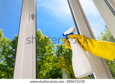 cleaning open plastic vinyl window on a background blue sky