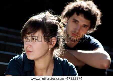 young couple after quarrel outside
