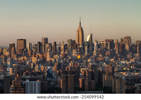 View of New York City from the top of the Brooklyner building during sunset in the summer.