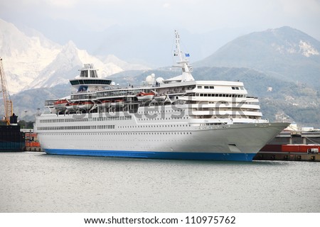 Cruise ship docked in Italy against mountain