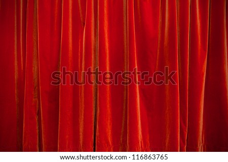 background of velvet red theater curtain closed