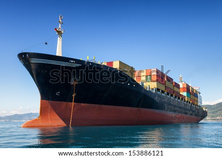 cargo container ship anchored in harbor