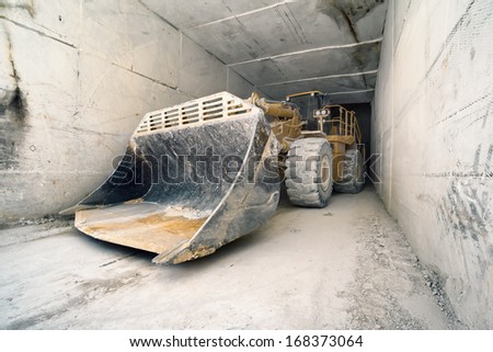 Colonata (Carrara), Italy, bulldozer in marble quarries tunnel