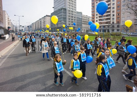 MILAN, ITALY - March 15: circa 30.000 children and parents join the Andemm al Domm parade on March 15, 2014 in Milan, Italy.