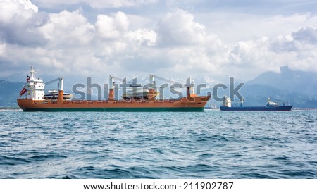 two cargo ship moving boats
