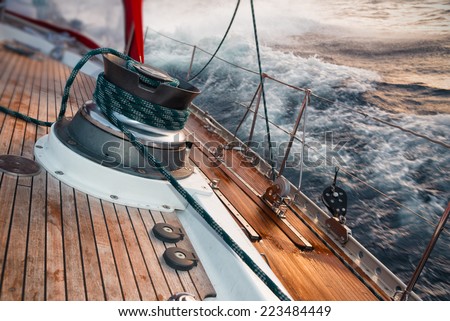 sail boat under the storm, detail on the winch