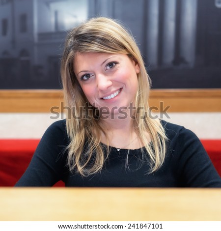 welcome, smiling girl on reception desk