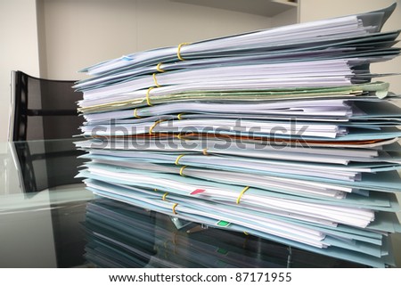 file stack on office desk