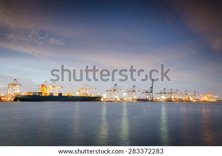 industrial port with containers at night