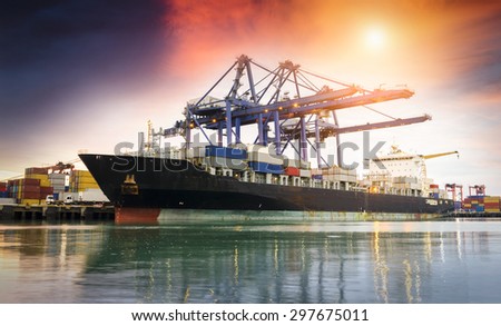 Containers loading by crane at dark , Trade Port , Shipping