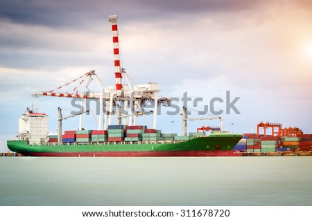 Containers loading by crane in the morning Trade Port Shipping Containers loading by crane in the morning Trade Port Shipping