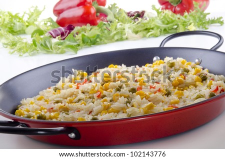 spanish vegetable paella with bell pepper, sweet corn and pea