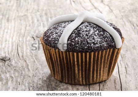 chocolate cupcake with icing sugar and powder
