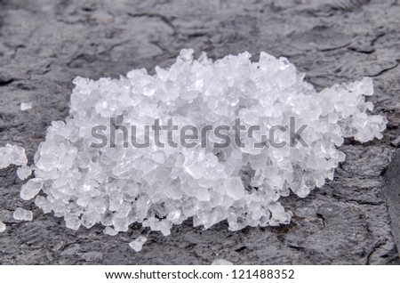 some rough sea salt on a small slate