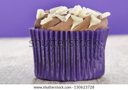 cupcake with chocolate butter cream and white chocolate curls