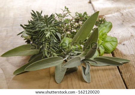 fresh herbs on an old farm house table