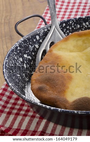 Langos, home made Hungarian pancake in a pan