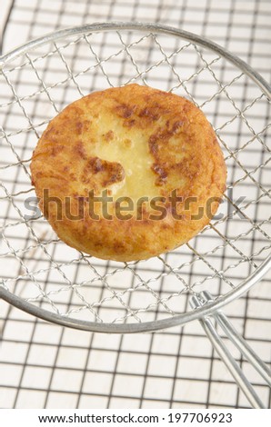 freshly baked potato cake on a round spatula
