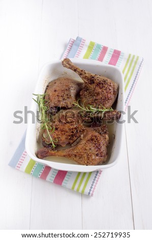 warm oven baked duck legs with rosemary