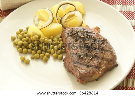 grilled pepper steak with organic potato and pea