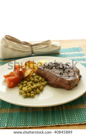 grilled pepper steak with organic potato and pea