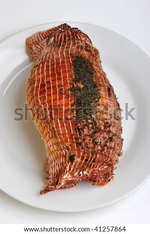 grilled organic stuffed turkey leg on a plate