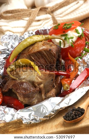 braised meat in tinfoil with grilled paprika