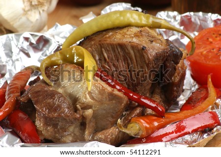 braised meat in tinfoil with grilled paprika
