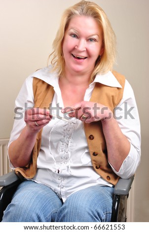 woman in a wheelchair with clinical thermometer