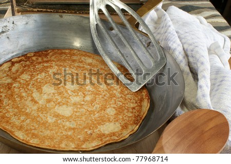 home made pancake in an old brass pan