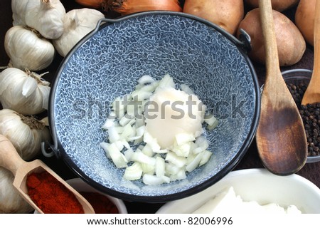 Lard with onions in a small pot