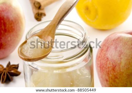 Apple sauce on a small wooden spoon