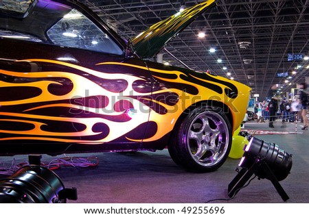 BUDAPEST - MARCH 19: Tuning car with special painting on international tuning show with reflector lights in Hungexpo on March 19, 2010 in Budapest, Hungary