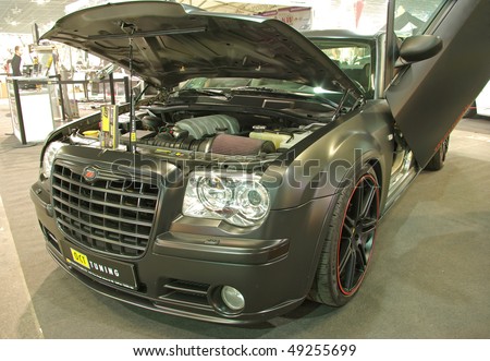 BUDAPEST - MARCH 19: Tuning Chrysler 300C SRT8 car under hood on international tuning show with reflector lights in Hungexpo on March 19, 2010 in Budapest, Hungary