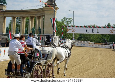 BUDAPEST, HUNGARY - JUNE 6: Coach training on Heroes square at racetrack of National Gallop on Heroes\' Square on 6th of June, 2010 in Budapest, Hungary