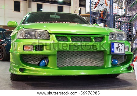 stock photo : BUDAPEST-MARCH 19: Tuned Nissan Skyline R34 GT car with fresh