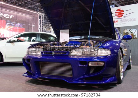BUDAPEST-MARCH 19: Tuned blue Nissan 200SX S14 car with special bumper and bonnet on international tuning show with details in Hungexpo at 19th of March, 2010 in Budapest, Hungary