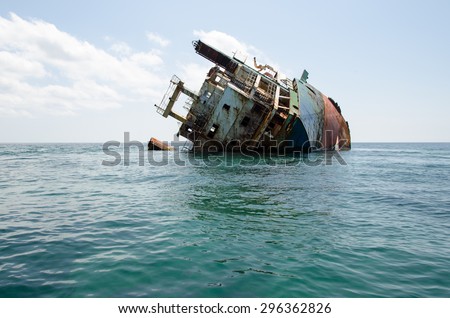 Shipwreck, rusty ship wreck, sunken ship on a bright sunny day
