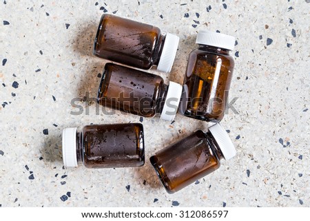 Used glass bottles for recycle on terrazzo floor