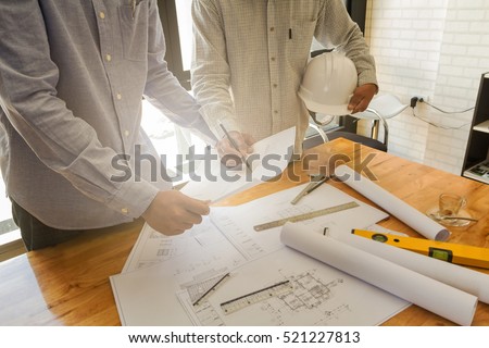 Architect discuss with engineer about project in office, architectural concept