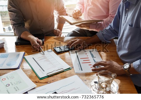 Business team meeting and discussing project plan. Businessmen discussing together in meeting room. Professional investor working with business project together. Finance managers task.