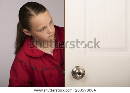 Girl behind door