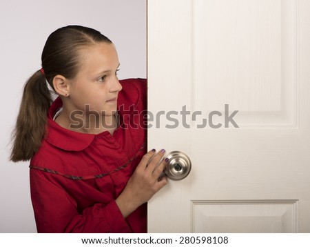 Girl behind door