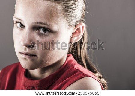 Softball girl looking tought