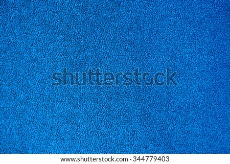 Abstract blue textured background. Texture of the pile fabric closeup.