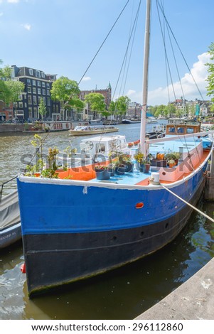 AMSTERDAM, MAY, 28, 2015. Tour-boat. Amsterdam is known as Venice of the North, it has 1,200 bridges and 165 canals. Best way to experience them is one of the boat tours.