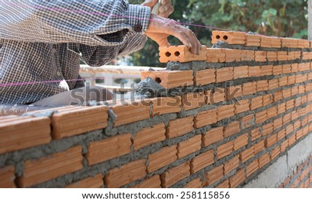 Construction bricklayer worker