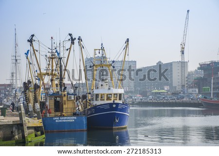 Port of Scheveningen, Zuid-Holland/Netherlands - April 24-04-15 - Fishing vessels Drie gebroeders, and KW-72 are moored along-side the quay. The vessels are preparing there Fishnets for sea.