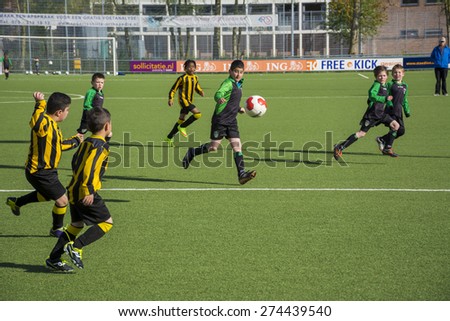 DEN HAAG, THE NETHERLANDS, MAY 02-05-2015 - kids from the soccer club Haagse voetbal vereniging RAS are playing a match against Duno. The children from the club RAS won the game.